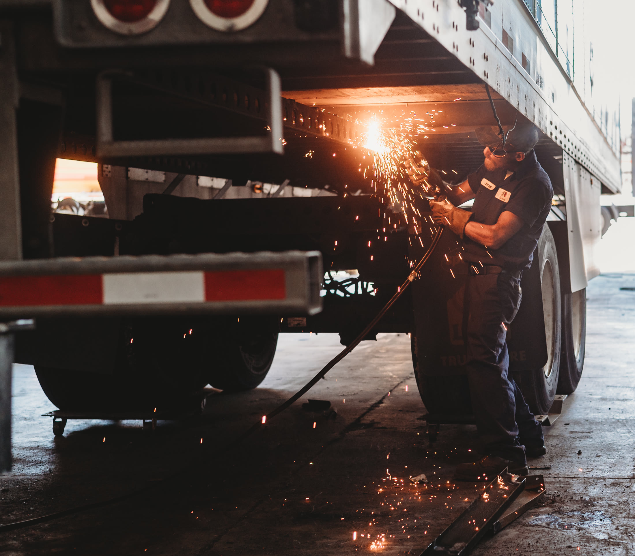 Welding a trailer in our service bay